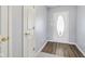 Bright entryway with wood floors with a decorative front door at 4615 Copper Grove Dr, Indianapolis, IN 46237