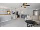 Open living room and kitchen layout with neutral color scheme and access to additional rooms at 4615 Copper Grove Dr, Indianapolis, IN 46237