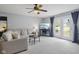 Comfortable living room with plush seating, a ceiling fan, and French doors leading to the backyard at 4615 Copper Grove Dr, Indianapolis, IN 46237