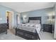 Spacious bedroom with a plush bed and a view of an open closet at 4615 Copper Grove Dr, Indianapolis, IN 46237
