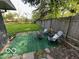Serene backyard offering ample green space, a fire pit, and a privacy fence at 4720 E 42Nd St, Indianapolis, IN 46226