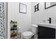 Chic bathroom with a modern vanity, white paneling, and stylish decor creating a clean and inviting space at 4720 E 42Nd St, Indianapolis, IN 46226