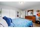 Bright bedroom featuring natural light, wood accents, and ample closet space for comfortable living at 4720 E 42Nd St, Indianapolis, IN 46226