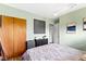 Relaxing bedroom featuring light walls, wood accents, and simple decor create a calming oasis at 4720 E 42Nd St, Indianapolis, IN 46226