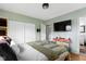 Spacious bedroom with natural light, closet space, modern decor, and a comfortable bed for relaxation at 4720 E 42Nd St, Indianapolis, IN 46226