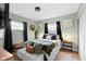 Cozy bedroom featuring a comfortable bed with decorative pillows, natural light, and stylish furnishings at 4720 E 42Nd St, Indianapolis, IN 46226