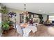 Open-concept dining room with access to the living room, modern decor, and a stylish light fixture above the table at 4720 E 42Nd St, Indianapolis, IN 46226