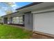 A gray home featuring an attached one car garage at 4720 E 42Nd St, Indianapolis, IN 46226