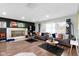 Bright living room with hardwood floors, fireplace, and ample seating at 4720 E 42Nd St, Indianapolis, IN 46226