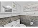 Modern bathroom with decorative tile, a sink, and vanity storage at 4721 E Morris St, Indianapolis, IN 46203