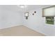 Cozy bedroom with neutral carpet, window, and fresh paint at 4721 E Morris St, Indianapolis, IN 46203