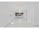 Open-concept living room with modern lighting and marble-style floors at 4721 E Morris St, Indianapolis, IN 46203