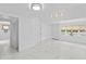 Open-concept living room with modern lighting and marble-style floors at 4721 E Morris St, Indianapolis, IN 46203