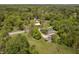 Sprawling aerial view showcases houses surrounded by lush greenery under a partly cloudy sky at 503 E Bunker Hill Rd, Mooresville, IN 46158