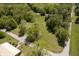 Captivating aerial view of a suburban landscape with houses nestled among mature trees and green spaces at 503 E Bunker Hill Rd, Mooresville, IN 46158
