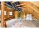 Attic space with exposed wood beams, wood framing, and natural light from windows at 503 E Bunker Hill Rd, Mooresville, IN 46158