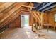 Unfinished attic space with exposed wood beams, access to a deck, and potential for customization at 503 E Bunker Hill Rd, Mooresville, IN 46158