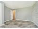 Gray room with wood-look floors and accent wall, showing off the neutral design at 503 E Bunker Hill Rd, Mooresville, IN 46158