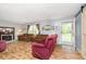 Inviting living room featuring a fireplace, comfortable seating, natural light, and a sliding barn door at 503 E Bunker Hill Rd, Mooresville, IN 46158