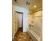 Clean bathroom featuring shower-tub combo and neutral finishes at 5313 Brandywine Dr, Whitestown, IN 46075