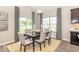 Bright dining room features a stylish table with seating for six and a decorative rug, perfect for Gathering meals at 5313 Brandywine Dr, Whitestown, IN 46075