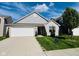 Charming brick home with a well-manicured lawn, two-car garage and beautiful curb appeal at 5313 Brandywine Dr, Whitestown, IN 46075