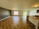 Bright, spacious living room features modern vinyl floors and a large window at 5313 Brandywine Dr, Whitestown, IN 46075