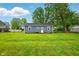 Back of house featuring siding, roof, and large yard at 532 W 1050 N, Fortville, IN 46040