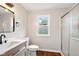 Updated bathroom with a modern vanity, black hardware, and a shower with glass doors at 532 W 1050 N, Fortville, IN 46040