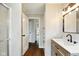 Hall bathroom featuring modern vanity with large mirror and shower with glass door at 532 W 1050 N, Fortville, IN 46040