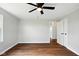 Spacious bedroom with hardwood floors, ceiling fan, and closet space at 532 W 1050 N, Fortville, IN 46040
