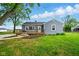 Charming single-story home featuring a cozy porch and lush green lawn at 532 W 1050 N, Fortville, IN 46040