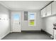 Clean and functional garage space with ample storage, a window, and an exterior door at 532 W 1050 N, Fortville, IN 46040