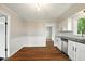 Updated kitchen with white cabinetry, stainless steel dishwasher, and sleek black countertops at 532 W 1050 N, Fortville, IN 46040