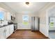 Well-lit kitchen with stainless steel appliances, white cabinetry, and modern finishes at 532 W 1050 N, Fortville, IN 46040