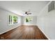 Spacious room with large bay window, hardwood floors, and modern ceiling fan at 532 W 1050 N, Fortville, IN 46040