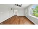 Inviting living room with hardwood floors and large windows, offering plenty of natural light at 532 W 1050 N, Fortville, IN 46040