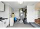 Utility room featuring essential systems, storage cabinets, and access to additional space at 532 W 1050 N, Fortville, IN 46040