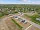 An aerial view displays new homes in a community surrounded by trees, parks, and green landscapes at 558 Plowman Dr, Shelbyville, IN 46176