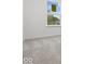 Bright bedroom featuring a window, plush carpeting and neutral colored walls at 558 Plowman Dr, Shelbyville, IN 46176