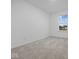 A carpeted bedroom with a window and blank walls at 558 Plowman Dr, Shelbyville, IN 46176