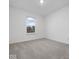 Empty bedroom featuring soft carpeting and a view of the outside at 558 Plowman Dr, Shelbyville, IN 46176