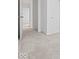 Hallway featuring neutral-colored walls and flooring, seamlessly connects various rooms at 558 Plowman Dr, Shelbyville, IN 46176