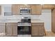 Modern kitchen featuring stainless steel appliances, granite countertops, and ample cabinet space at 558 Plowman Dr, Shelbyville, IN 46176