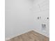 A clean, empty laundry room is ready for appliances and storage, ideal for organization at 558 Plowman Dr, Shelbyville, IN 46176