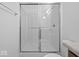 A pristine white shower with a glass enclosure and chrome fixtures, enhancing the bathroom's appeal at 558 Plowman Dr, Shelbyville, IN 46176