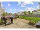 Backyard featuring a grill and a seating area, perfect for outdoor gatherings and relaxation at 5593 Ralfe Rd, Indianapolis, IN 46234