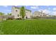 Large, beautifully maintained backyard with lush lawn and landscaped features creating an ideal outdoor space at 5593 Ralfe Rd, Indianapolis, IN 46234