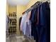 Organized walk-in closet with built-in shelving for efficient storage at 5593 Ralfe Rd, Indianapolis, IN 46234
