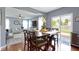 Dining area leading to a living room and a sliding door with backyard view at 5593 Ralfe Rd, Indianapolis, IN 46234